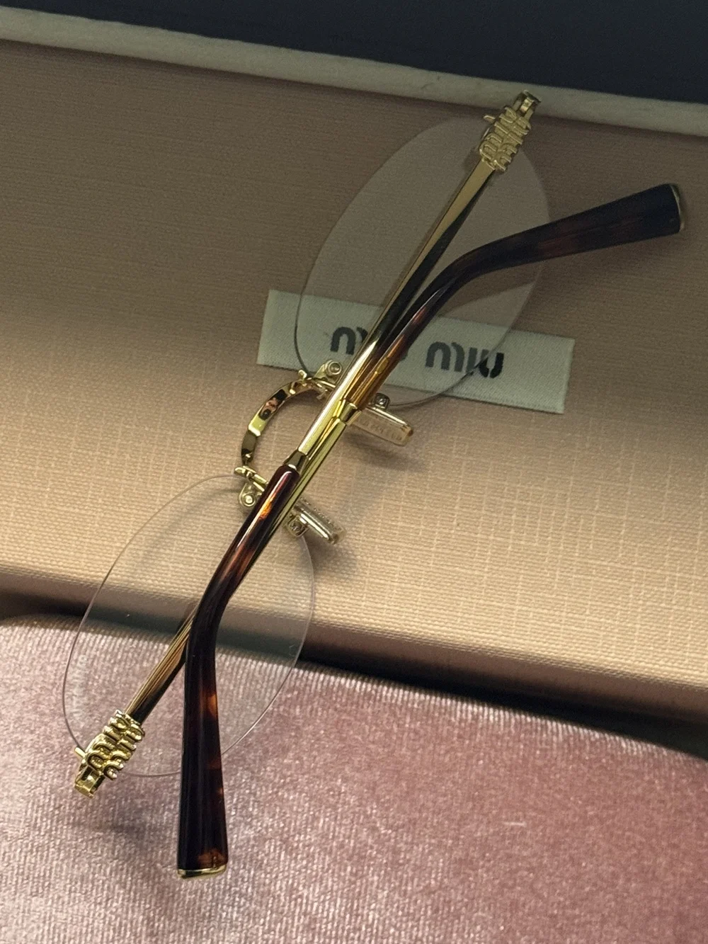 MIUMIU. miu rim‑less